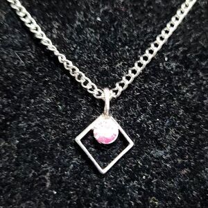 Silver Diamond shaped with a pink rhinestone and silver necklace